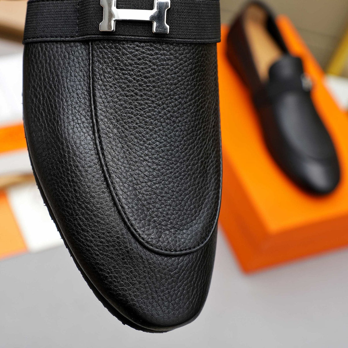 Hermès Black Pebbled Leather H-Hardware Loafers — detail