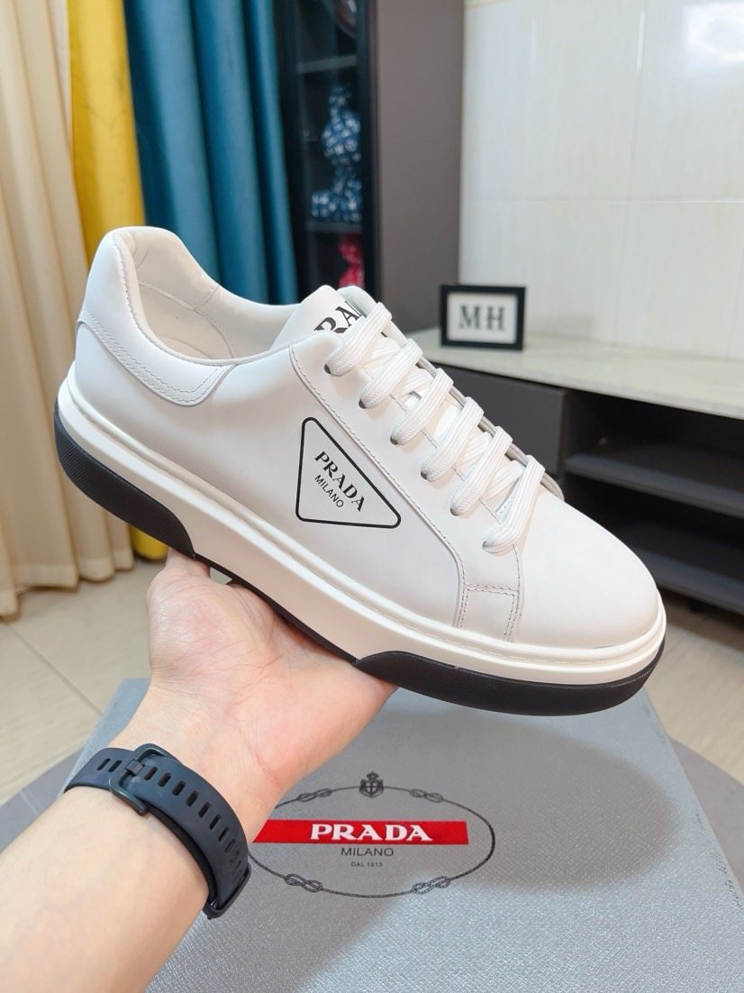 Prada Triangle Patch Low-Top Sneakers — model