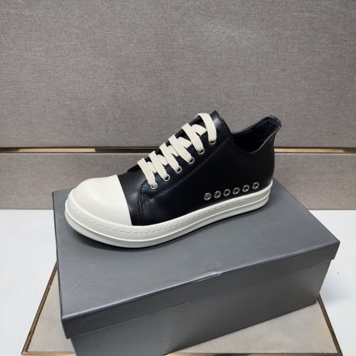 Black and Off-White Low-Top Sneakers — hero
